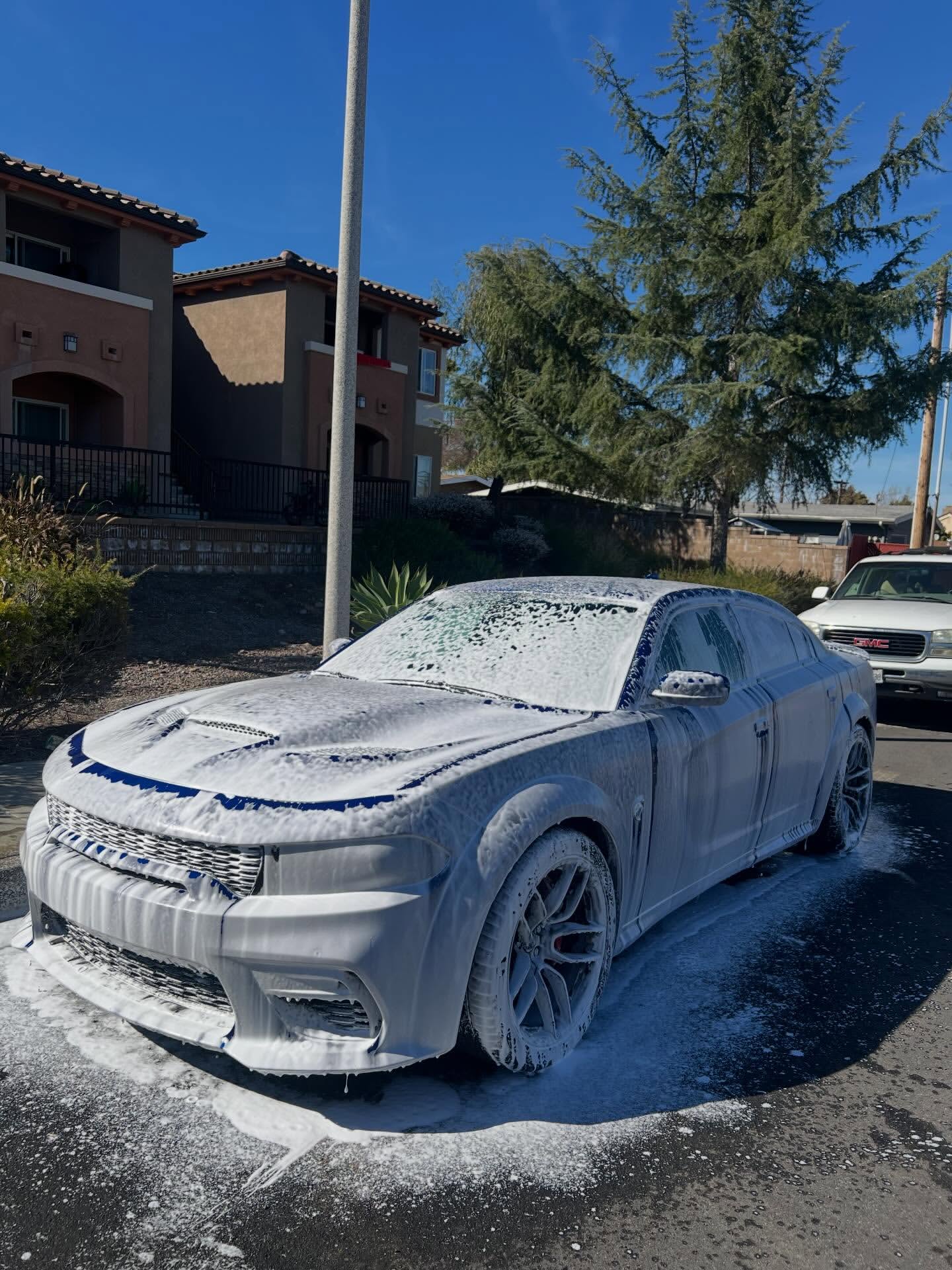 Dodge Charger during foam wash — before detail San Diego